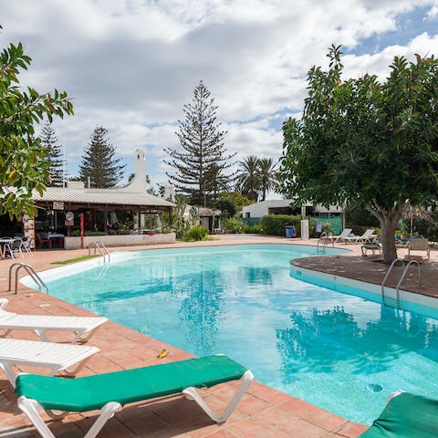 Relax around the communal pool before heading out for the day exploring