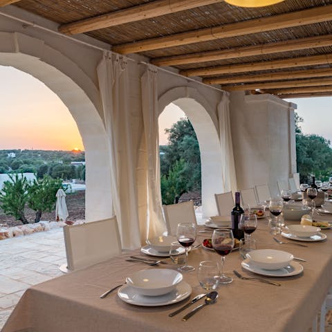 Dine al fresco on traditional Pugliese dishes prepared by the villa's private chef