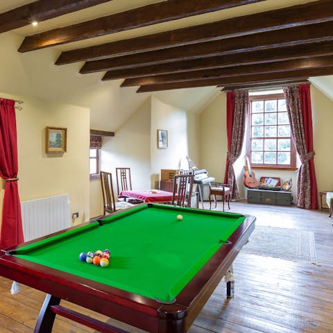 Enjoy downtime with a glass of wine and a game of pool