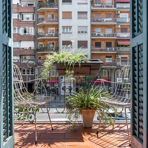 Sip a glass of Spanish wine on the private balcony at sunset