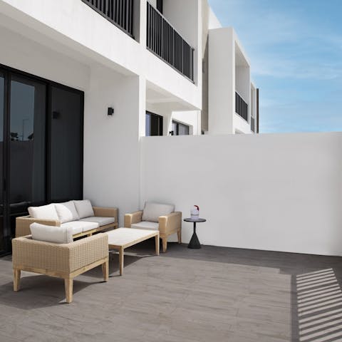 Soak up the sun in complete comfort in the alfresco lounge area