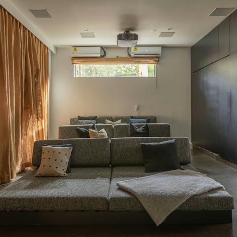 Watch a film in the home cinema after touring Universal Studios