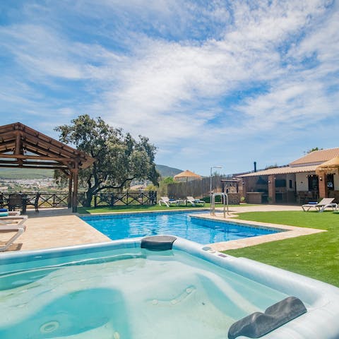 While away the day hopping between the private Jacuzzi and pool