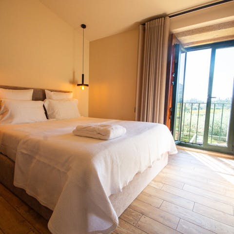 Wake up to peaceful green views from the double bedroom