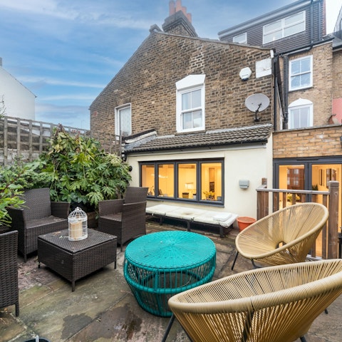 Enjoy a barbecue on a sunny day in the back garden