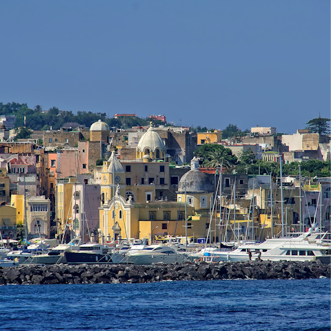 Tour the coastline of Ischia by boat or walk to Spiaggia della Chiaia
