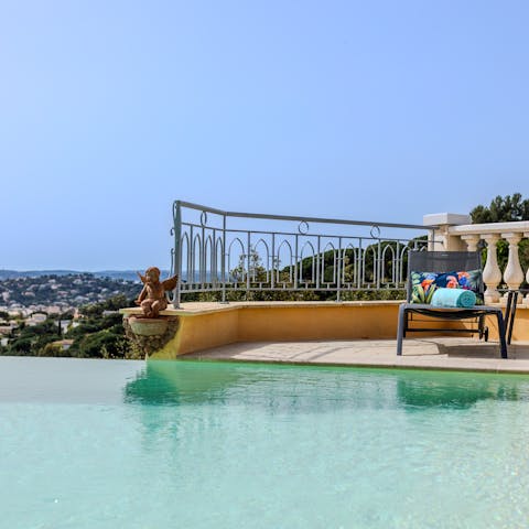 Flick through a magazine and sip a cocktail as you lay poolside
