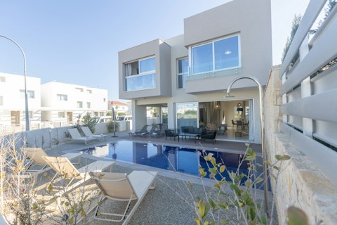 Stretch out on a sunbed beside the glistening pool