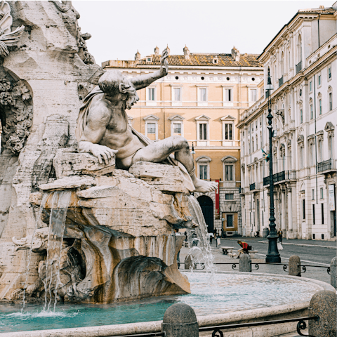 Admire the Fontana del Nettuno, just a four-minute walk from your apartment