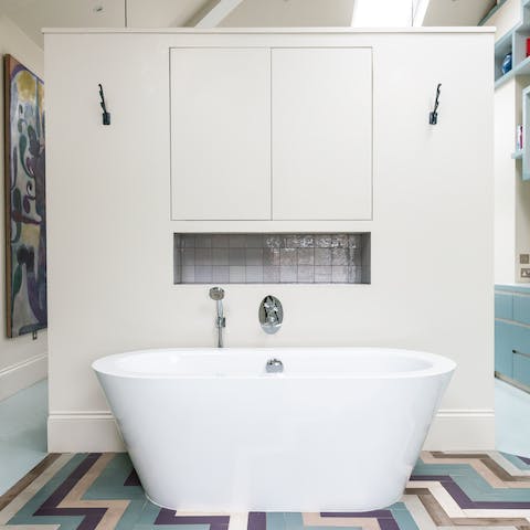 Treat yourself to an indulgent soak in the freestanding bathtub