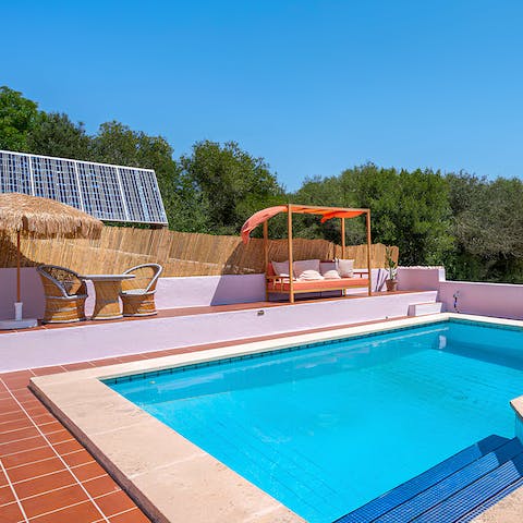 Swim in the private pool to cool off in the Menorcan sun