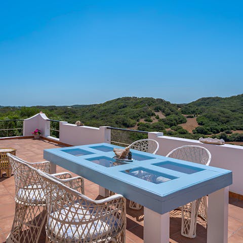 Enjoy an alfresco meal with views across Albufera de Grau Nature Park