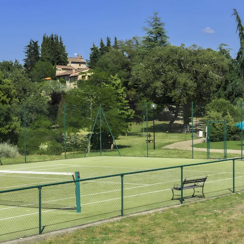 Play a game of tennis on the shared court