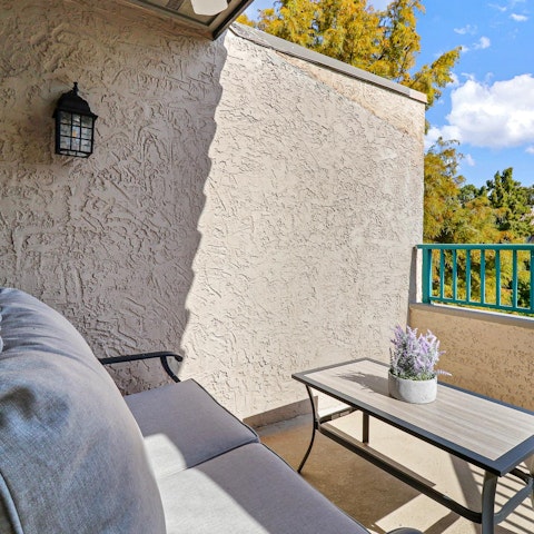 Enjoy a glass of wine on the small balcony