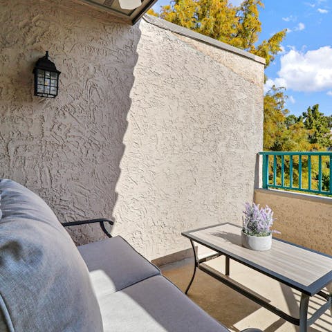 Enjoy a glass of wine on the small balcony