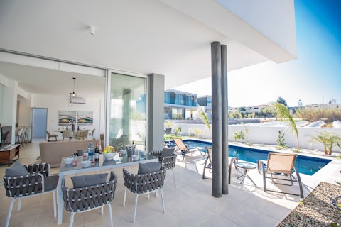Dine outside steps from the pool on a sun-soaked terrace