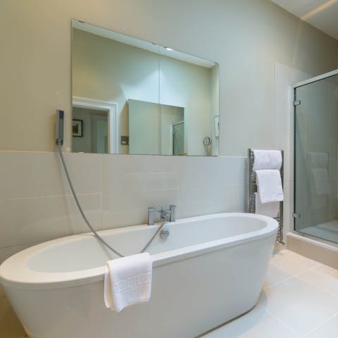 Sink into steamy waters in the freestanding bathtub