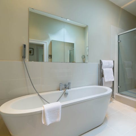 Sink into steamy waters in the freestanding bathtub