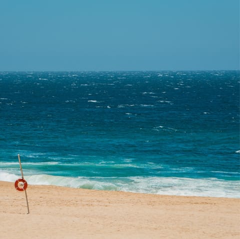 Cool off in the aquamarine waters of Medano Beach, just a nineteen-minute stroll away