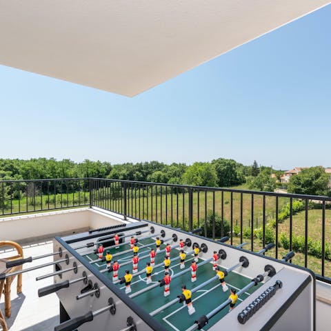 Challenge your guests to a game of alfresco table football