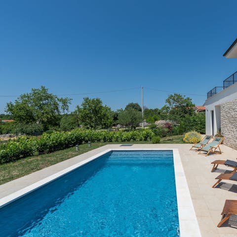 Relax on a lounger by the private pool before taking a dip
