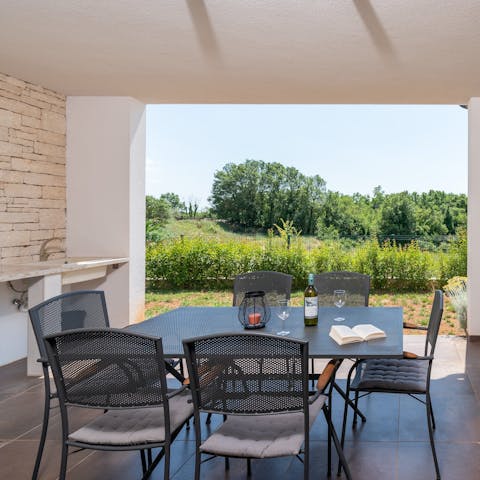 Enjoy a leisurely alfresco meal on the shaded dining terrace