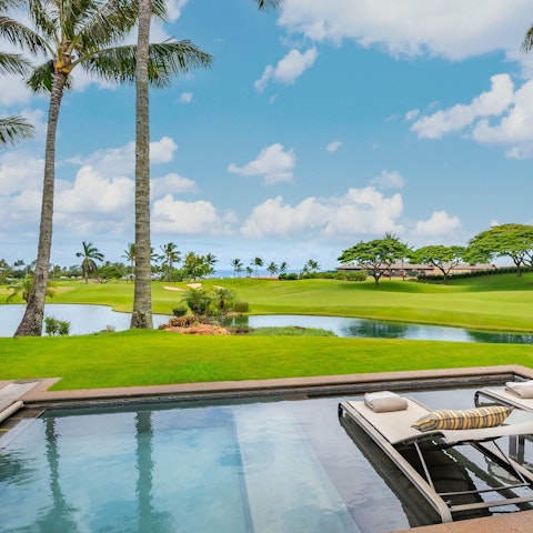 Enjoy views across the golf course from the private pool