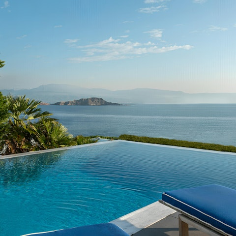 Swim in the private infinity pool under the Grecian sun