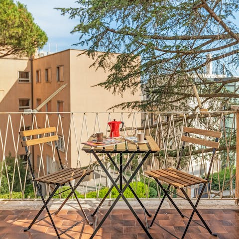 Relax with a glass of local wine on the charming balcony