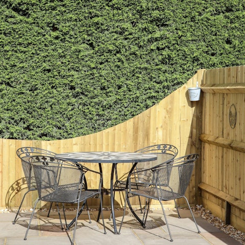 Share a bottle of wine on the sunny patio