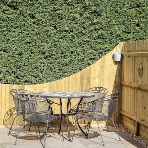 Share a bottle of wine on the sunny patio