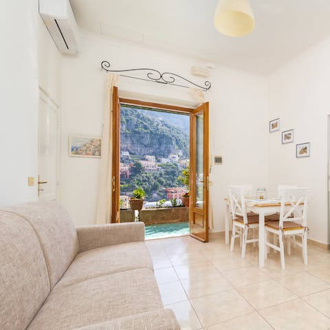Take in the vistas from the living room and bedroom over Positano