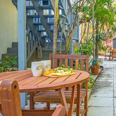 Sip your morning coffee in the shared lush backyard patio