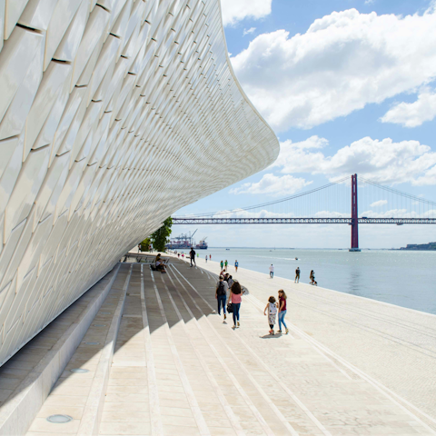Walk along the Tagus River towards the MAAT Museum