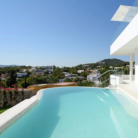 Take a dip in the magical infinity pool overlooking the hills