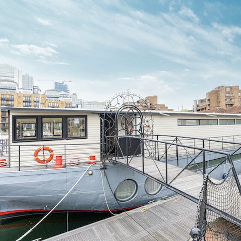 Stay on a huge converted steel barge, floating on the Thames at St Katharine Docks Marina