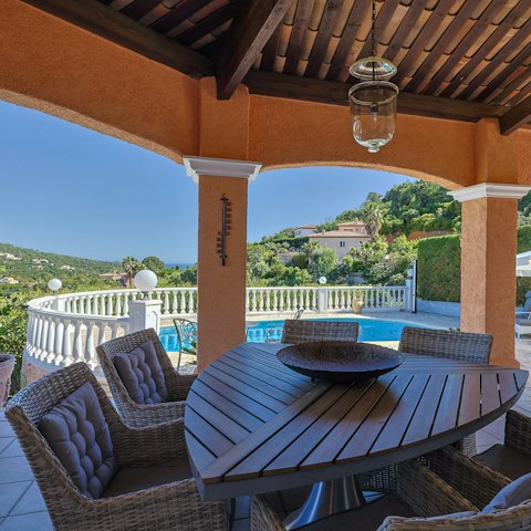 Dine alfresco-style at the spacious, shady outdoor table
