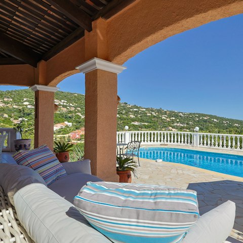 Relax on the cosy outdoor sofas, complete with a spectacular view of the surrounding hills