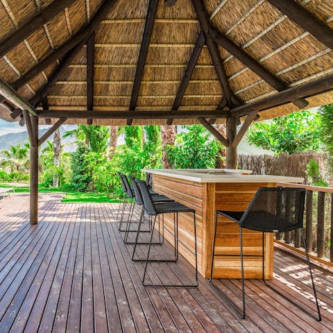 Sit at the bar in the shade and socialise with good drinks, or try your hand at mixing yourself