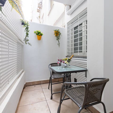 Enjoy a glass of sangria on the private terrace