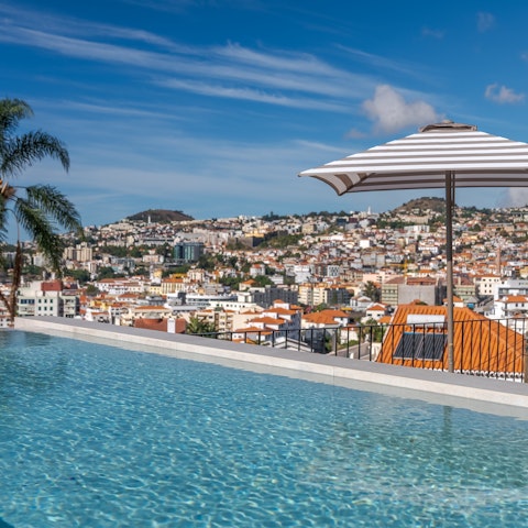 Admire gorgeous views from the rooftop pool