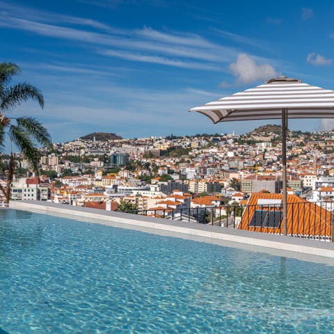 Admire gorgeous views from the rooftop pool