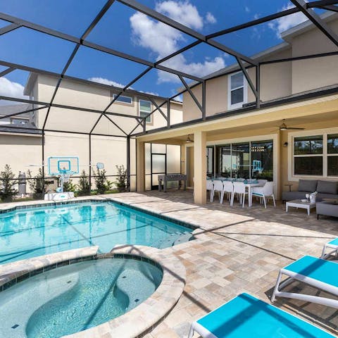 Unwind in the private screened-in pool and spa