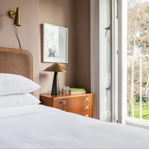 Wake up to sunlit views of the communal garden