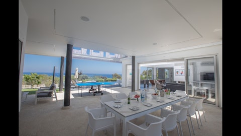 Dine outside as the sea fills every corner of the view