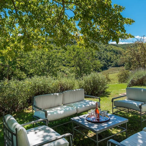 Relax under the trees while sipping on an Italian aperitif
