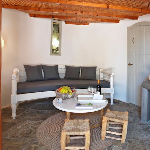 Enjoy an evening glass of wine in the living room of this unique design