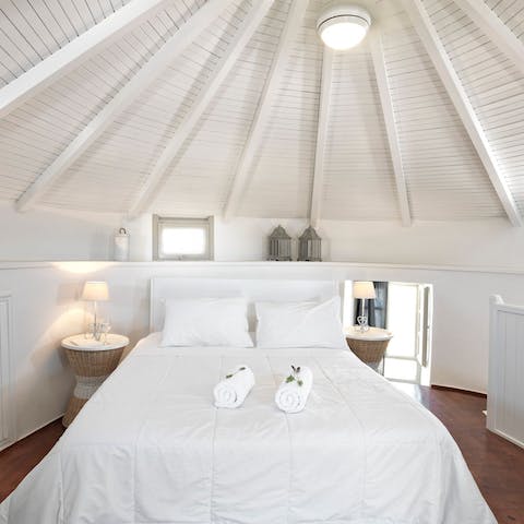 Relax and unwind in this comfortable and spacious master bedroom