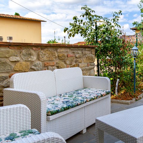 Flop down on the outdoor sofa with a cool drink and a good book