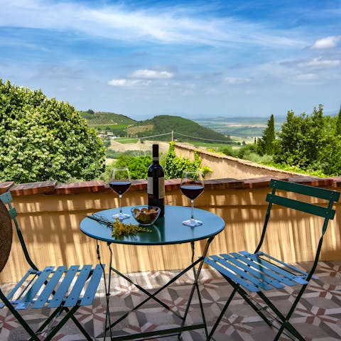 Share a bottle of locally-produced Chianti on the balcony